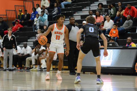 Jashon Gaines stares down an opponent before making a play at the rim.