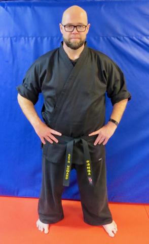 HCHS theater teacher Seth Howard earns his black belt at CMA of Hartwell in Dec. of 2022.