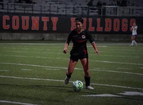 Senior forward Honor Chiang dribbles down the field as she scored two goals to pick up the Lady Dogs 4-2 win over Banks in the home opener to pick up the first win of the year. Photo taken by Lexie Wheless.