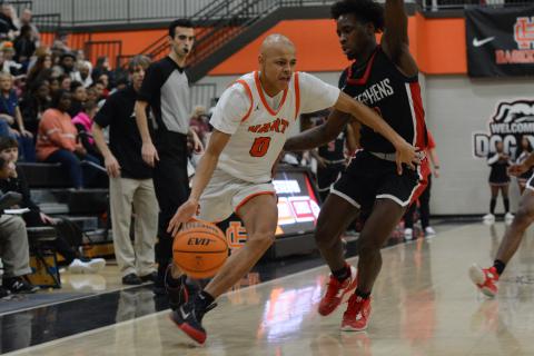 Sophomore guard Keelan Stowers fights off a defender in the 69-62 home win over the Stephens County Indians.