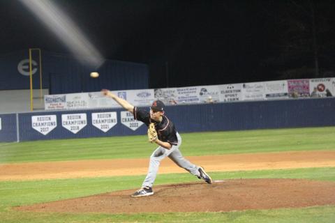 Senior pitcher Reece Maxwell delivers a pitch in the 9-4 road loss to Elbert County  in the season opener on Feb. 8. (Photo by Mark Wells at The Elberton Star)