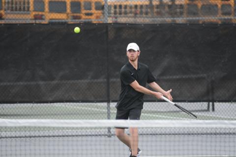 Senior Daniel Leard returns a serve in a 2022 match as the Lady Dogs start 1-0 and the Dogs start 0-1 on the season.