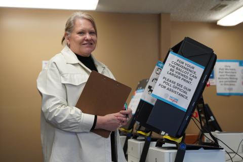 Hart County Elections Coordinator Robin Webb inspects one of the voting machines on Monday, as she finished the final preparations before Election Day on Tuesday.