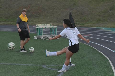 Pictured is senior forward Honor Chiang as she scores a hat-trick.