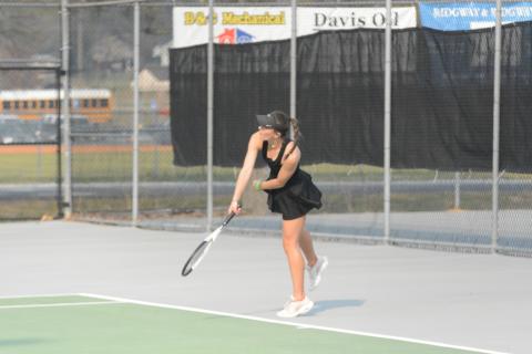Ryleigh Jordan returns a serve as she wins her line versus Monroe Area on Tuesday, 6-4 and 6-1.