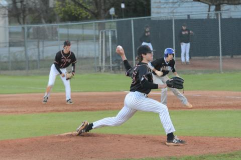 Junior starting pitcher Will Pittman delivers a pitch as the Dogs fall to Oconee in the double header on March 16.