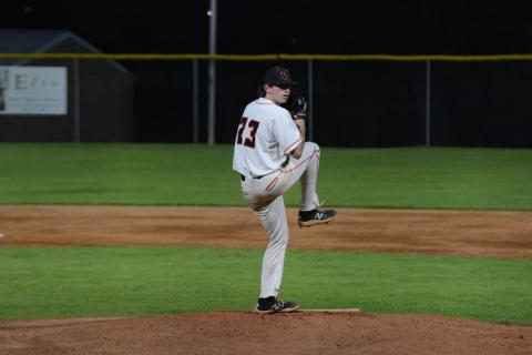 Junior pitcher Will Pittman winds up to deliver a pitch in the 7-1 loss against Prince Avenue Christian at home on Tuesday.