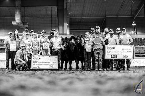 HCHS senior FFA student Ashlyn Floyd poses with family, friends, and her two heifers that both placed in the top-5 overall at the Georgia State Livestock Show in Perry. 