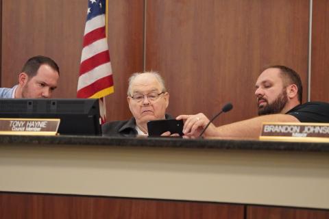 Hartwell City Council members (from left) Dan Leard, Tony Haynie and Mayor Brandon Johnson take a first look at the proposed MLK mural to go downtown off Franklin Street. The council decided to approve funding for a mural, but asked for changes to be made to the original proposed design and would require council approval of the design before moving forward. 