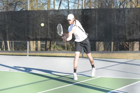 Pictured is senior Daniel Leard returning a serve.