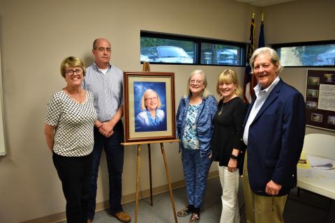 L-R: Glada Horvat, Richard Sanders, Emily Gunnells, Gail Gunnells and Walter Gordon stand alongside the newly unveiled portrait of Emily Gunnells, which will hang in a place of prominence in the Hart County Adult Learning Center. 
