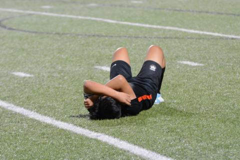 Senior left defensive back Jonathan Velazquez lies down after giving it his all in his final game for Hart County. As the Dogs lose 7-1 on the road to Wesleyan in the first round of the state playoffs.