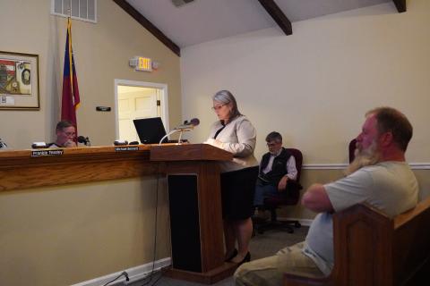 County attorney Kim Higginbotham reads the rules regarding public comment to the Hart County Board of Commissioners during Tuesday’s meeting while Jim Gaines (right) listens on. 
