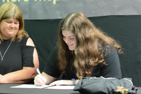 Senior Barnes Academy cheerleader Abbey Johnson (right) signs with Emmanuel College on Monday, May 15 to continue her academic and cheer career with the Lions. Her mom, Vickie Johnson, is pictured left.