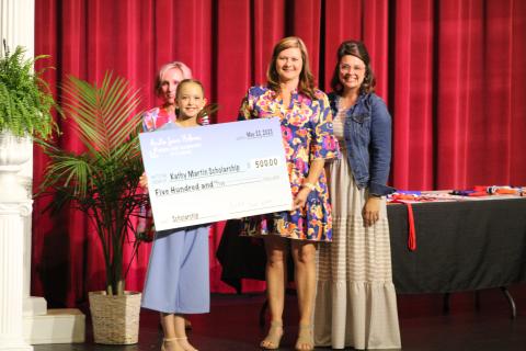 Andie Jane Holmes (front) was recognized at the North Hart Elementary award’s ceremony for raising funds for the annual Kathy Ford Martin Memorial Scholarship. 