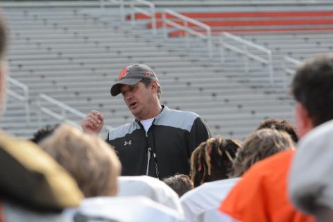 Head coach Cory Dickerson talking with the team after the team’s first day in full pads on Monday, May 8.