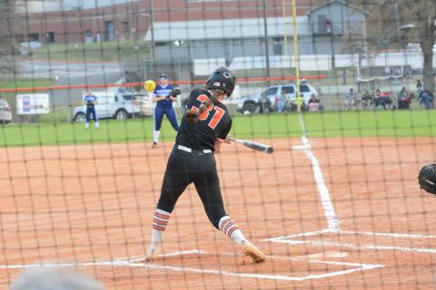 Emma Faust swings for the fences in a slow-pitch softball game versus Elbert County during the 2023 season.