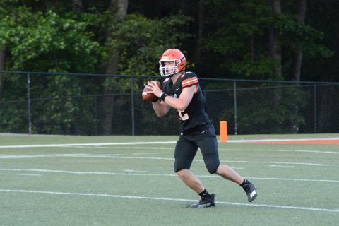 Pictured is rising senior quarterback Kip Phillips as he sets to deliver a 70-yard touchdown pass to Trey Martin.