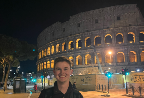 Dawson Baker stands in front of the Colosseum in Rome, Italy during Easter weekend. The Colosseum was constructed during the first century A.D.   