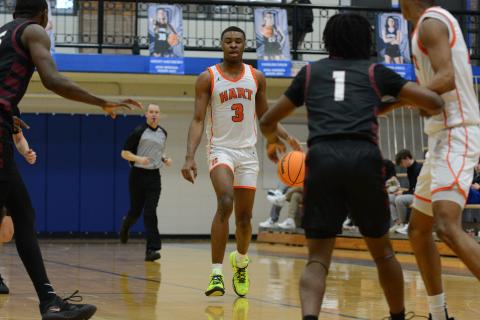 Forward Tahj Johnson (3) drives to the lane in the 47-43 win over Hebron Christian in the Region 8-AAA consolation game at Oconee County on February 17.