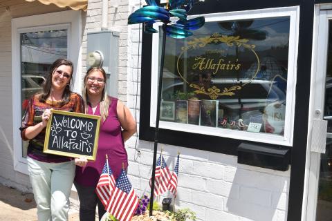 Mother-daughter duo Darlene Nixon (left) and Brooke Dutton (right) stand out front of their new business, Allafair’s, on North Forest Avenue. 