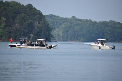 Three boats gathered around the location of where the body of 44 year-old Constantin Pascal was found late Saturday evening.