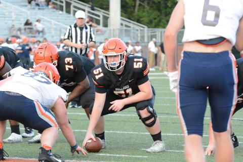 Rising junior offensive lineman Adam Broom (51) gets ready to snap the football during the 2023 spring game versus Habersham Central on Friday, May 19 from Herndon Stadium. 