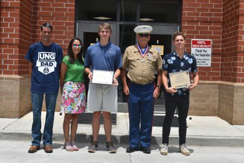 The Georgia Military Veterans Hall of Fame recently presented certificates to two Hart County High School graduates. Pictured from left are Keith McLane, Jamie McLane, Kaden Johnson-McLane, Chief Warrant Officer 4 Ray Fairman (retired) and Andrew Brezeale.