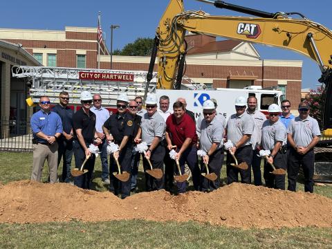 Breaking ground for the new Fire Station Project are Mayor Brandon Johnson, City Manager Jon Herschell, Fire Chief Alan Daniels, Kevin Price, President of Kevin Price Construction, Retired Fire Chief Terry Vickery, team members of Price Construction and Precision Planning Inc., and Fire Department personnel.