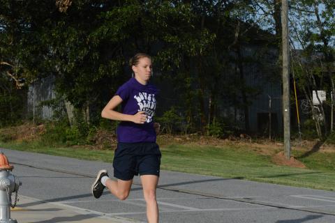 Senior runner Madison McLane working on her two mile time