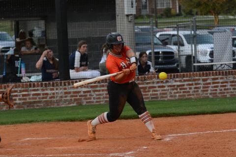Senior outfielder Alexis Davis hits the ball into the gap in center field in the 9-3 win against Habersham Central in the Lady Dogs home opener Tuesday, Aug. 15.