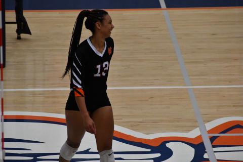 Senior middle hitter Alexis Walker smiles after winning a set as the Volley Dogs sweep Habersham Central in three sets to start the year 1-0. 