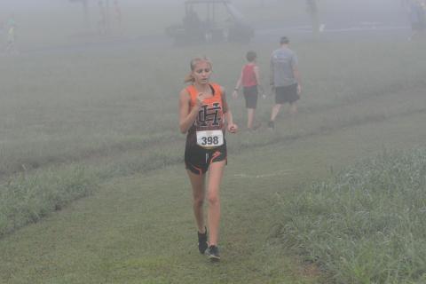 Senior Chloe Bennett fights through her injury to finish the race at East Jackson Aug. 12.