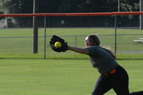 Senior outfielder Alexis Davis dives for the catch during a summer practice as they prepare for their season opener on the road versus Jackson County on August 8.