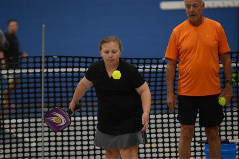 Gracie Driver (left) returns a serve at the youth pickleball camp hosted by the Bell Family YMCA on July 24-28.