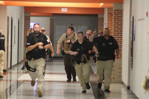 Law enforcement officers from multiple agencies clear the halls of Hart County High School during an Active Shooter Simulation Drill.