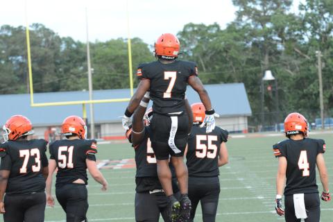Senior running back Nori Moore (7) celebrates with his teammate after scoring a touchdown in the 2023 spring game versus Habersham Central on Friday, May 19 in Herndon Stadium.