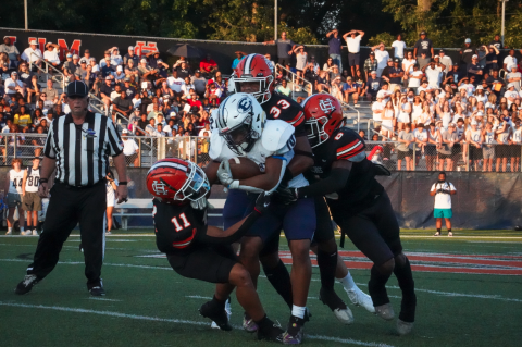 A host of Bulldog defenders tackle the Blue Devils running back in the 24-14 loss to Elbert County in the season opener. (Photo by Lexie Wheless)