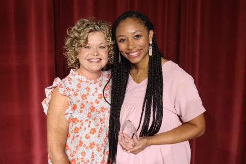 Britney Morrison, the 2023-2024 Hart County Charter System Teacher of the Year, pictured right, poses for a photo at Convocation alongside Superintendent Jennifer Carter. 