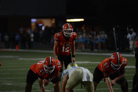 Senior quarterback Kip Phillips (12) awaits the snap in the loss to Daniel Sept. 8, 52-21.