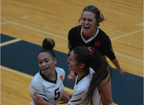 Pictured from left to right are seniors Kiera Jester, Lillie Kate Rogers, and Abby Hubbard celebrating a set win, as the Volley Dogs advanced to the Elite Eight after back-to-back sweeps over Cedar Grove and LaFayette High School.