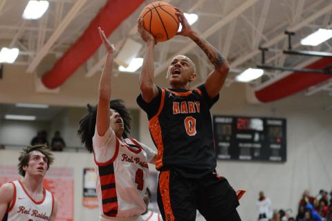 Junior guard Keelan Stowers goes up for the contested shot in the 86-56 loss to Madison County on Nov. 28.