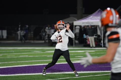 Senior quarterback Kip Phillips slings a 42-yard pass to senior wide receiver Jashon Gaines to tie it at 7-7 in the first quarter of play, as the Dogs would go onto fall to Monroe Area on the road, 23-14. 