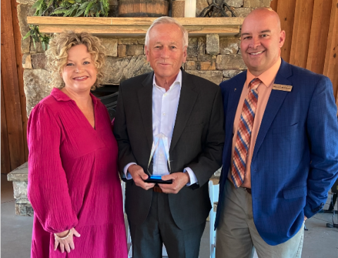 Photo to the left: Mr. Charles Corbett, center, who was named this year’s ‘Pioneer in Education’, poses for a photo alongside Superintendent Jennifer Carter, left, and Associate Superintendent Brooks Mewborn, right.