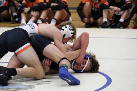 Junior Harrison Krause pins an Oconee County Warrior during a 2022-2023 match.