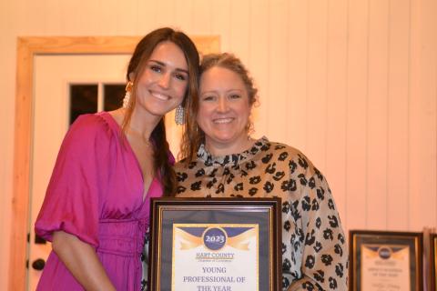 Hart County Chamber of Commerce Executive Director Lindsey Ingle presents owner Eliza Banks of Banks Hollow with the Young Professional of the Year award Jan. 27 during the chamber’s awards gala. 