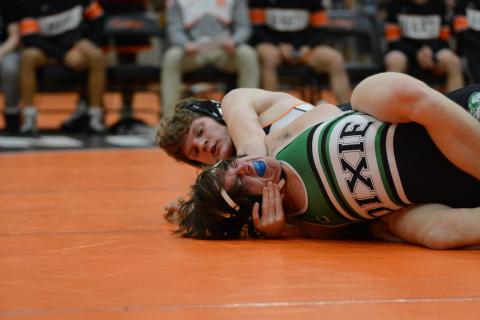 Ethan Stovall pins his opponent and wins his match during the Mat Dogs home meet against Dixie High School Jan. 16.