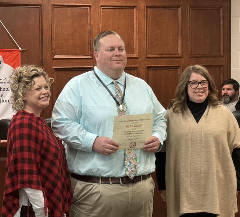 From left to right: Superintendent Jennifer Carter, HCHS Principal Kevin Gaines, and Board Chair Kim Pierce. Gaines was recognized for HCHS exceeding the state average in all five categories of the College and Career Readiness Performance Index (CCRPI).