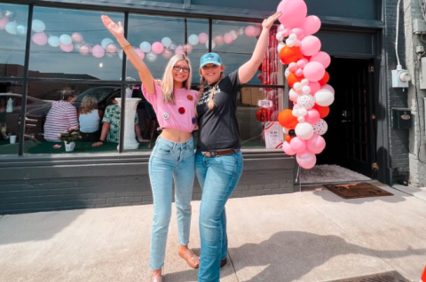 Owners of Happy Hounds Faith Phillips (left) and Breanna Shattles (right) celebrate the opening of their pet grooming business on Depot Street in Hartwell in May of 2023. 