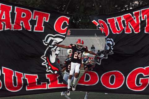 Riyan Partlow (24) runs through the banner before kickoff against Bulloch Academy on Sept. 22, 2023. 